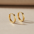 Gold Huggie Earrings with hinged hoop design in 18k gold